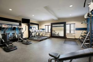 a gym with several treadmills and machines in it at Hampton Inn Los Angeles Int'l Airport/Hawthorne in Los Angeles
