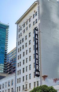 a hotel sign on the side of a building at The Wayfarer Downtown LA, Tapestry Collection by Hilton in Los Angeles