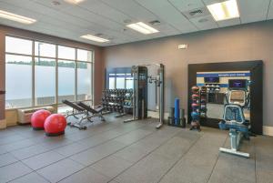 a gym with weights and equipment in a room at Hampton Inn Lumberton, NC in Lumberton