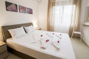 Katil atau katil-katil dalam bilik di Litsarda Villas Collection +9 gambar