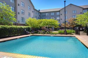 a swimming pool in front of a building at Homewood Suites by Hilton Lexington-Hamburg in Lexington