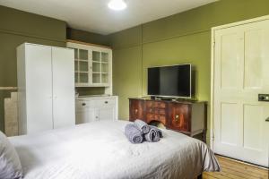 Ένα ή περισσότερα κρεβάτια σε δωμάτιο στο Vintage Room-Only Room