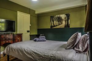 Un ou plusieurs lits dans un hébergement de l'établissement Vintage Room-Only Room