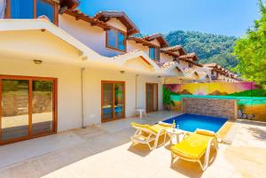a house with a swimming pool in the backyard at Villa Derya Paradise in Dalyan