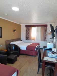 Postel nebo postele na pokoji v ubytování Travellers Motel