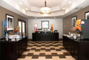 a hair salon with a checkerboard floor at Hampton Inn Maumelle in Maumelle