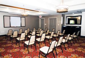 a room with a bunch of chairs and a screen at Hampton Inn Maumelle in Maumelle