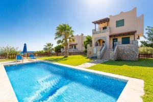 The swimming pool at or close to Spiros Villas Collection