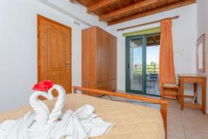 A bed or beds in a room at Spiros Villas Collection