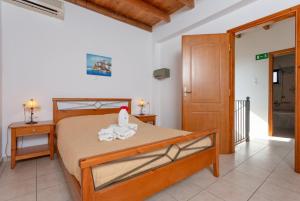 A bed or beds in a room at Spiros Villas Collection