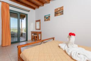 A bed or beds in a room at Spiros Villas Collection