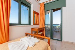 A bed or beds in a room at Spiros Villas Collection
