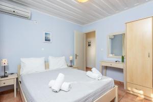 Posteľ alebo postele v izbe v ubytovaní Maria Beach House