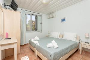 Posteľ alebo postele v izbe v ubytovaní Maria Beach House