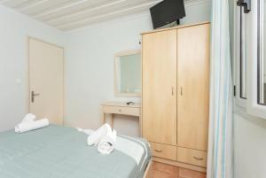 Posteľ alebo postele v izbe v ubytovaní Maria Beach House