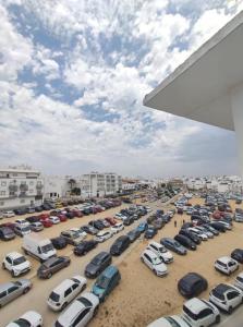 a parking lot full of cars in a parking lot at Ático en Barbate in Barbate