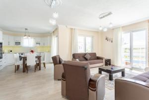 a living room with a couch and a table at Villa Veli in Dalyan