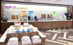 a store lobby with a top it bakery counter at Tru By Hilton Lawrence in Lawrence