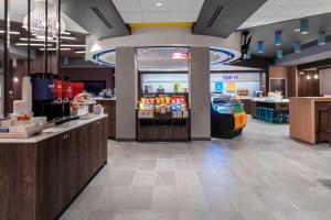 a lobby of a convenience store with a food counter at Tru By Hilton Lynchburg, Va in Lynchburg