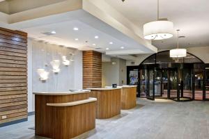 a lobby with a row of counters in a store at Embassy Suites by Hilton Orlando Downtown in Orlando