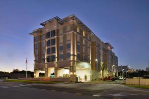 a building on a street in front of a building at Hampton Inn & Suites Orlando/Downtown South - Medical Center in Orlando