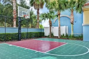 a basketball court with a hoop and palm trees at Homewood Suites by Hilton Lake Buena Vista - Orlando in Orlando