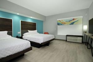 Tru By Hilton Meridian客房内的一张或多张床位