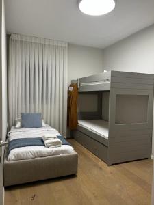 a bedroom with a bed and a bunk bed with a bunk bed at David Residence New Private apartment in Jerusalem
