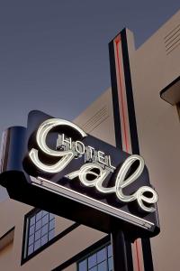 a sign for a hoffer cafe on the side of a building at Gale South Beach, Curio Collection By Hilton in Miami Beach