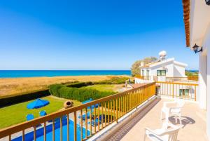 a balcony with a view of the ocean at Blue Bay Villa Dimitris in Mavroli