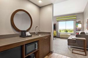 a hotel room with a sink and a mirror at Hampton Inn & Suites Miami, Kendall, Executive Airport in Kendall