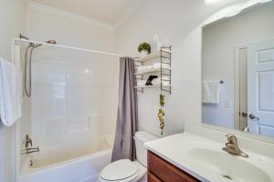a bathroom with a tub and a sink and a toilet at Semora Vacation Rental with Dock on Hyco Lake! in Semora +32 photos