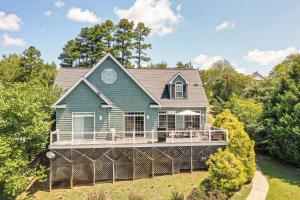 a house with a wrap around porch with a wrap around deck at Semora Vacation Rental with Dock on Hyco Lake! in Semora