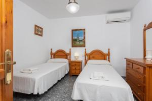 Postel nebo postele na pokoji v ubytování Villa Casa Leo + 16 fotografií