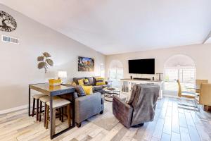a living room with a couch and a table at WeeCasa in Chandler