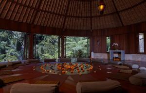 a large room with a large table with candles on it at Bagus Jati Health & Wellbeing Retreat in Tegalalang