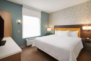 Postel nebo postele na pokoji v ubytování Home2 Suites By Hilton Palm Bay I 95