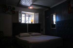Postel nebo postele na pokoji v ubytování Mamba Hotel