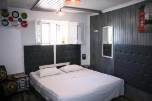 Postel nebo postele na pokoji v ubytování Mamba Hotel