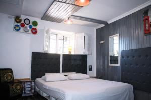 Postel nebo postele na pokoji v ubytování Mamba Hotel