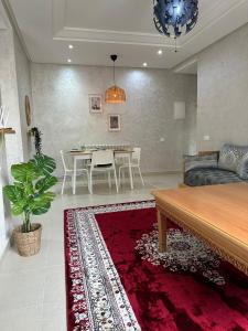 a living room with a couch and a table at Ifrane apartment with swimming pool in Ifrane