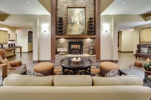 a living room with a couch and a fireplace at Hampton Inn & Suites Mooresville in Mooresville