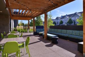 a patio with tables and chairs and a pergola at Home2 Suites By Hilton Eagan Minneapolis in Eagan