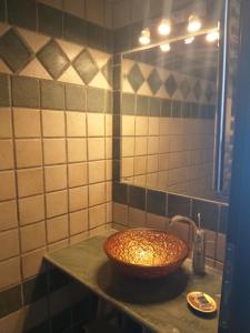 a bathroom with a sink and a mirror at Calma Luxury House in Marmari +11 photos