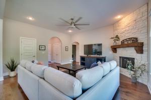 a living room with a couch and a fireplace at Fayetteville Vacation Rental with Deck and Shared Pool in Fayetteville
