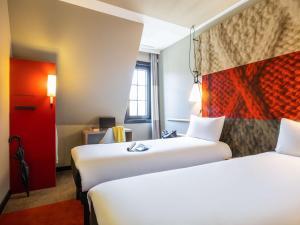 Postel nebo postele na pokoji v ubytování ibis Hotel Brussels off Grand'Place