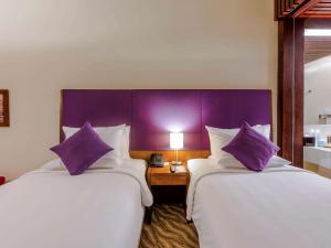 Postel nebo postele na pokoji v ubytování Novotel Nha Trang