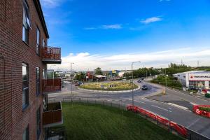 a view of a city street from a building at Brand New apartment next to Lakeside Shopping mall, Essex in West Thurrock