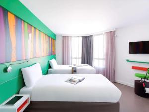 Postel nebo postele na pokoji v ubytování ibis Styles Montpellier Centre Comedie