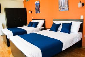 Postel nebo postele na pokoji v ubytování Hotel PLATINIUM